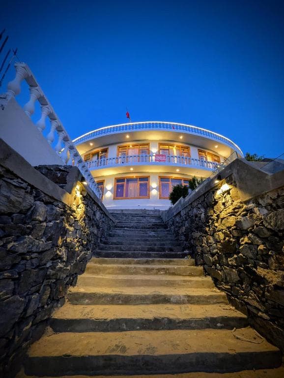 Exterior of Reechan Resort Skardu showing the main building and welcoming entrance, Outside view of Reechan Resort Skardu highlighting a comfortable stay setting in Skardu